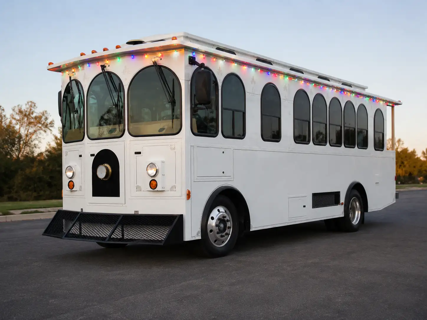 White Christmas trolley illuminated with colorful holiday lights