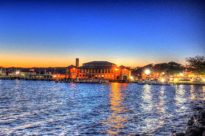 Lake Geneva, WI waterfront and boat docks illuminated at dusk